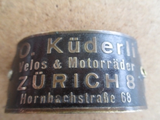 O.Küderli Steuerkopf  CH  Schild Emblem